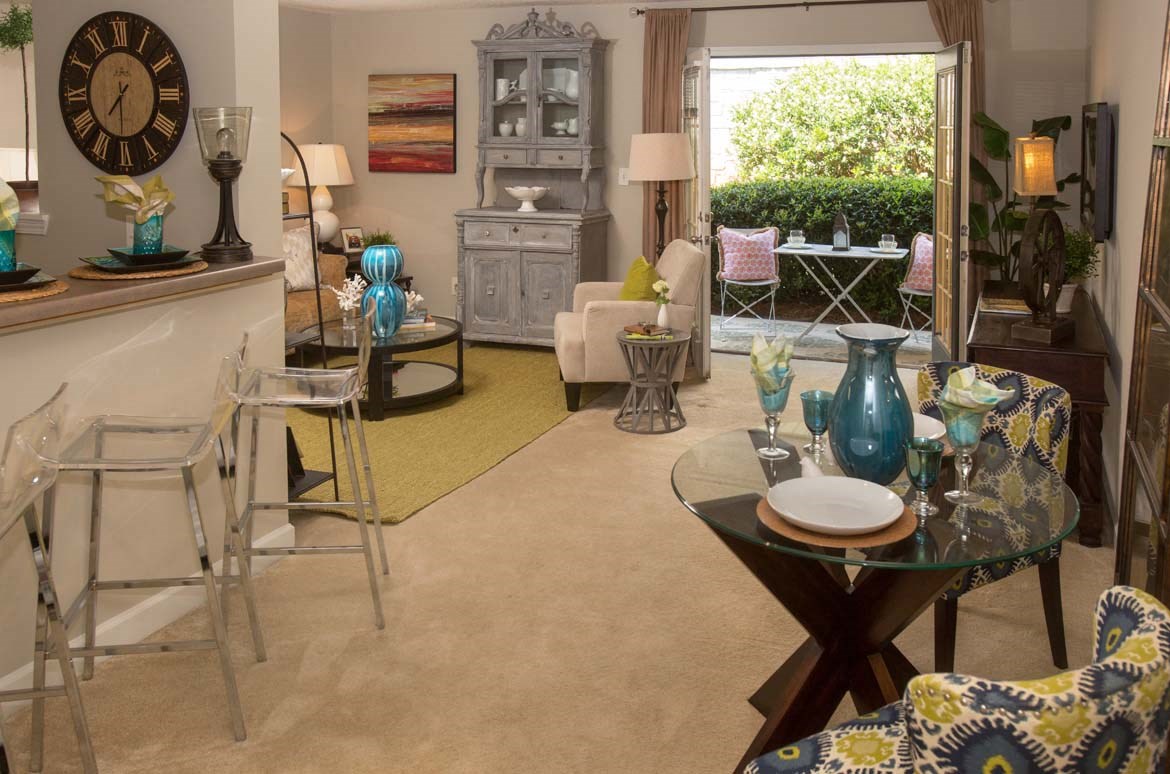 a living room filled with furniture and a table